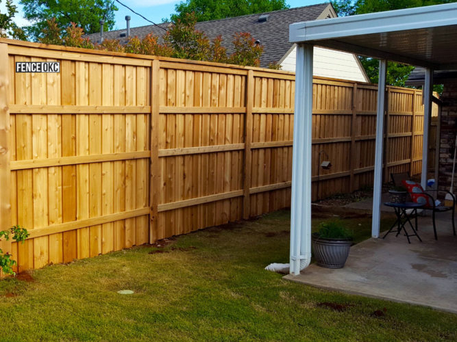 8' Cedar Board on Board Stockade Fence With Postmaster Posts and Cap & Trim