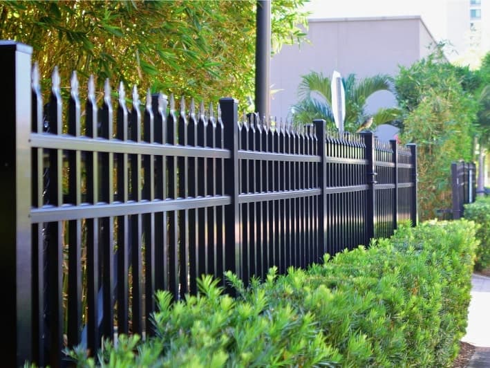 Three fences on an Oklahoma neighbors shared fence line.