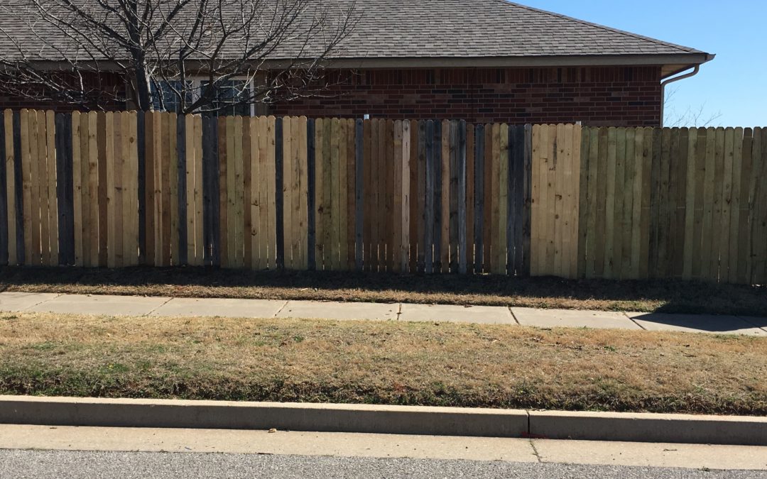 Replacing old cracked and splintered fence pickets.