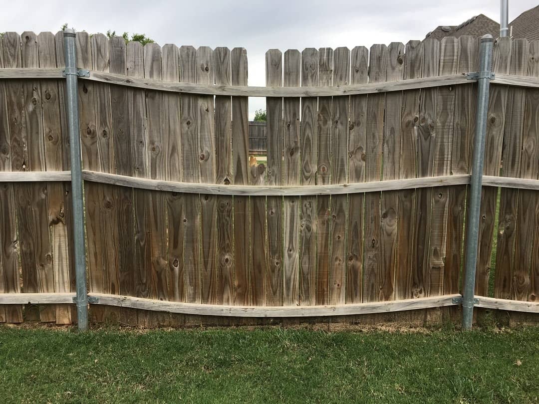 Old stockade fence that needs to be removed and replaced.