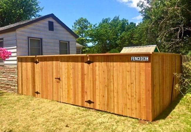 Six foot cedar fence installed with double-drive gate in Oklahoma.