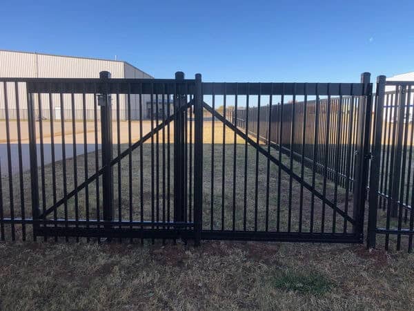 Commercial iron fence installation in Oklahoma by Fence OKC.
