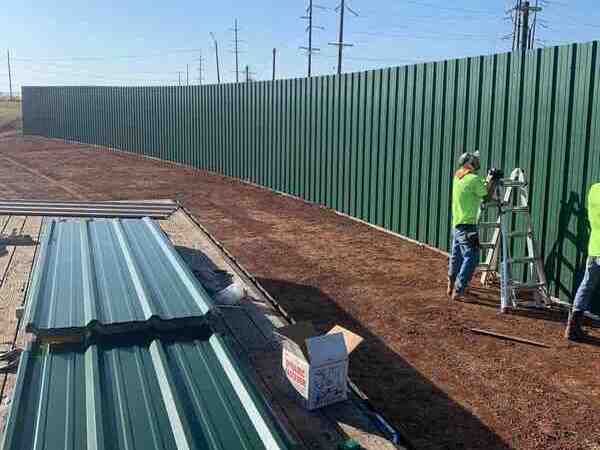 Commercial R-panel fence installation in Oklahoma by Fence OKC.