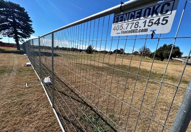 Fence OKC installs temporary fence panels in Oklahoma City, Oklahoma.