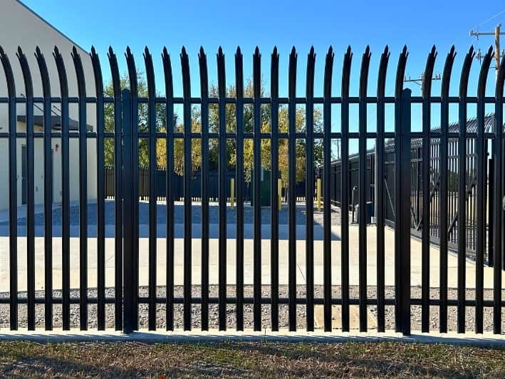 Security fence surrounding a business in Oklahoma City, symbolizing safety and protection.