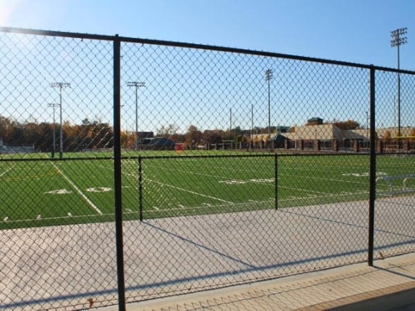 Commercial chain link fence installed at a high school football field in Oklahoma.